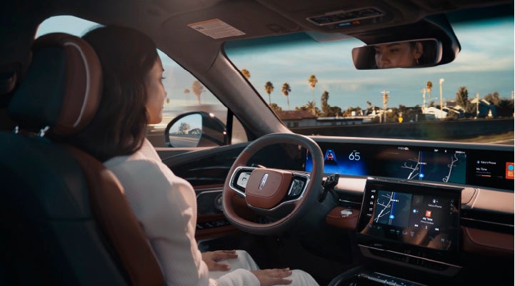 A person is shown driving hands-free on the highway with available Lincoln BlueCruise technology. | Klaben Lincoln of Warren in Warren OH